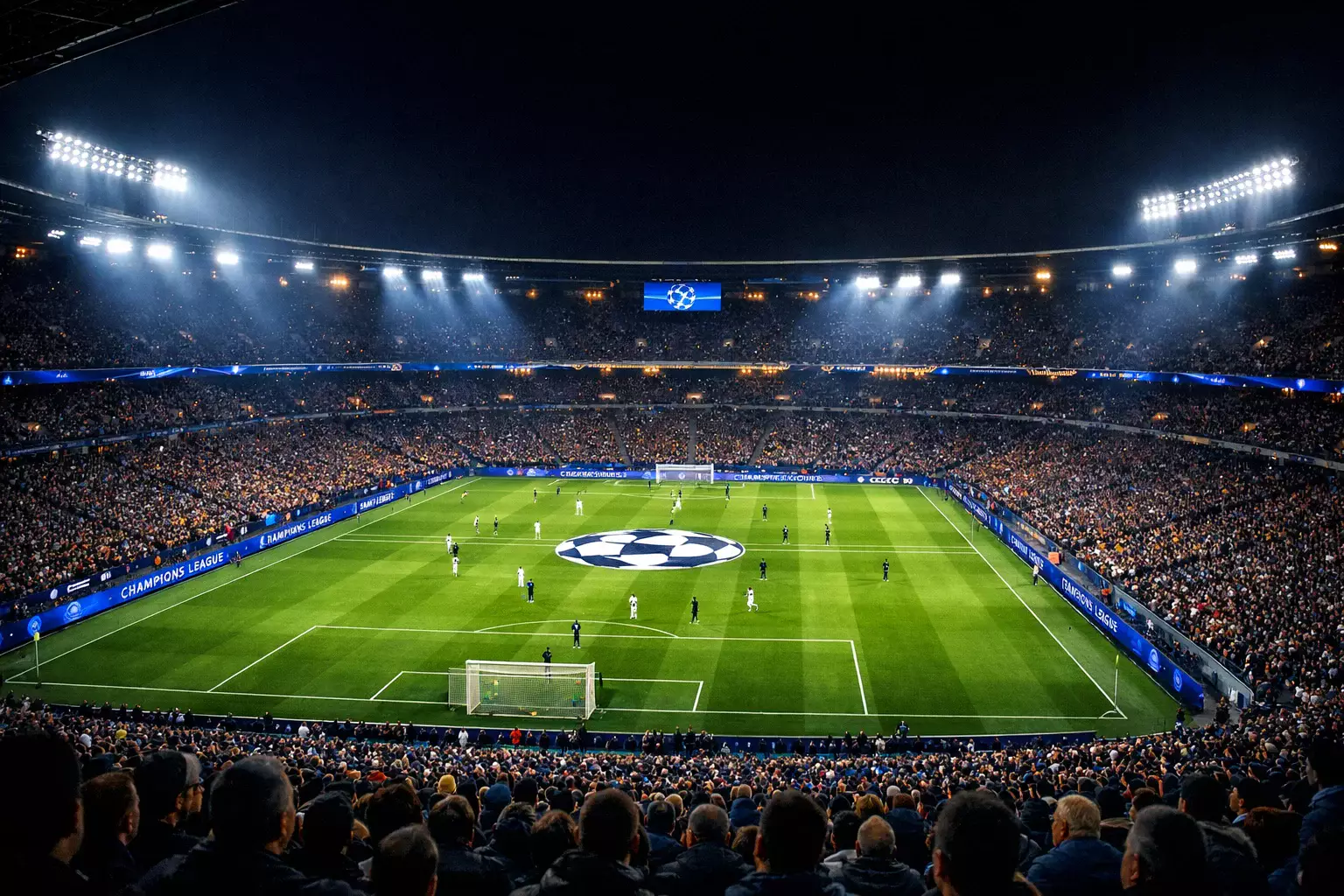 Beleuchtetes Fußballstadion bei Nacht während eines Champions League Spiels